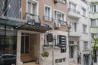 Exterior of MLS Hotel Şişli with signage, accessible via Elemen Transfer.