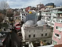 Aerial view of historic stone buildings and domed structures in Sultanahmet.
