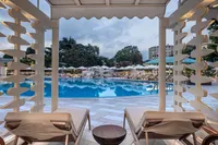 Outdoor swimming pool and sun loungers at Hilton Istanbul Bosphorus.