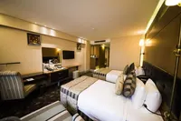 Modern twin bed guest room interior at Taksim Gönen Hotel.