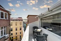 Istanbul street view from Taksim Trust Hotel balcony with an open book.