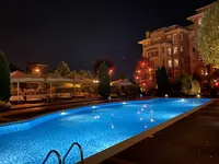 Illuminated blue pool and garden landscaping at Beyaz Konaklar.