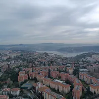 Aerial view of Etiler Istanbul with red-roofed buildings and Bosphorus view.
